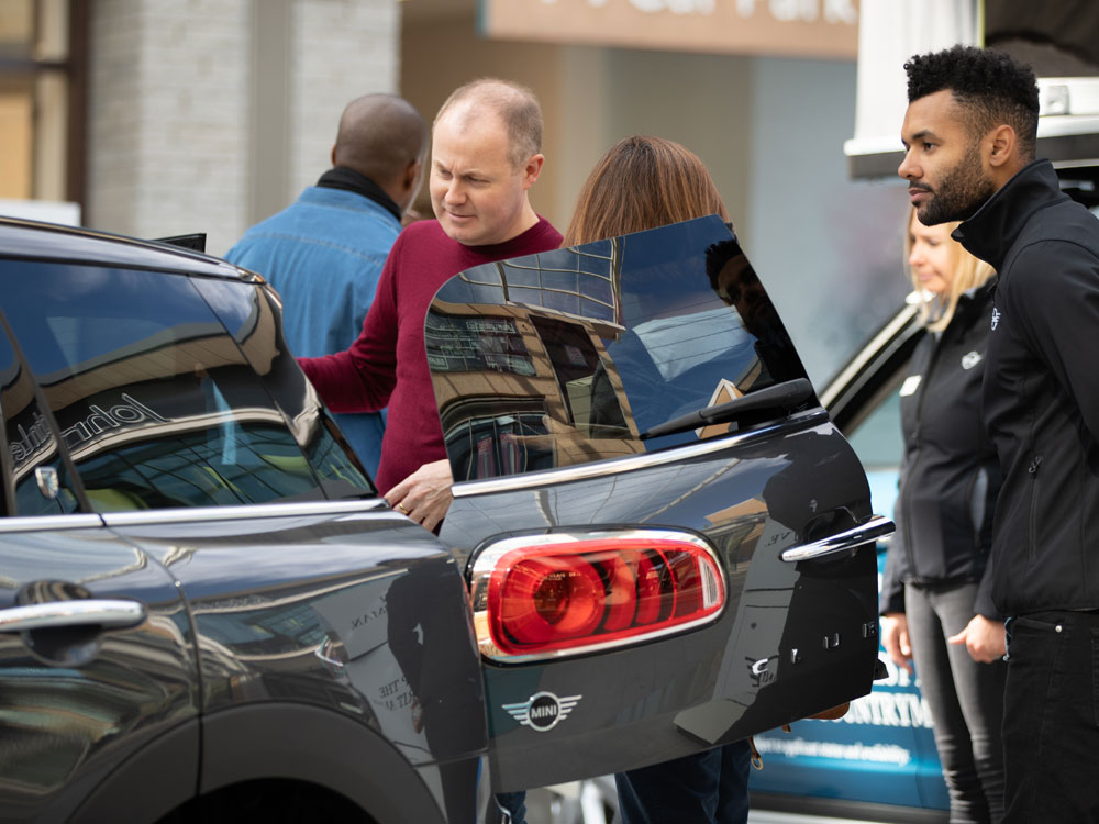 Person looking in MINI at promotional event