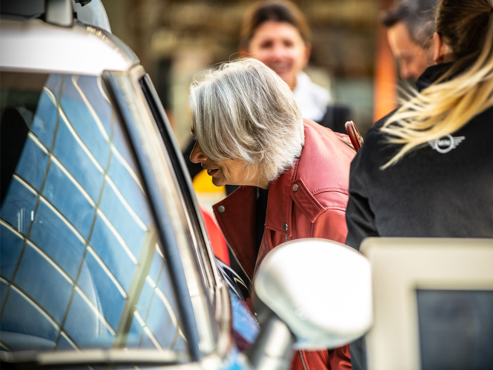 Person looking in MINI at promotional event